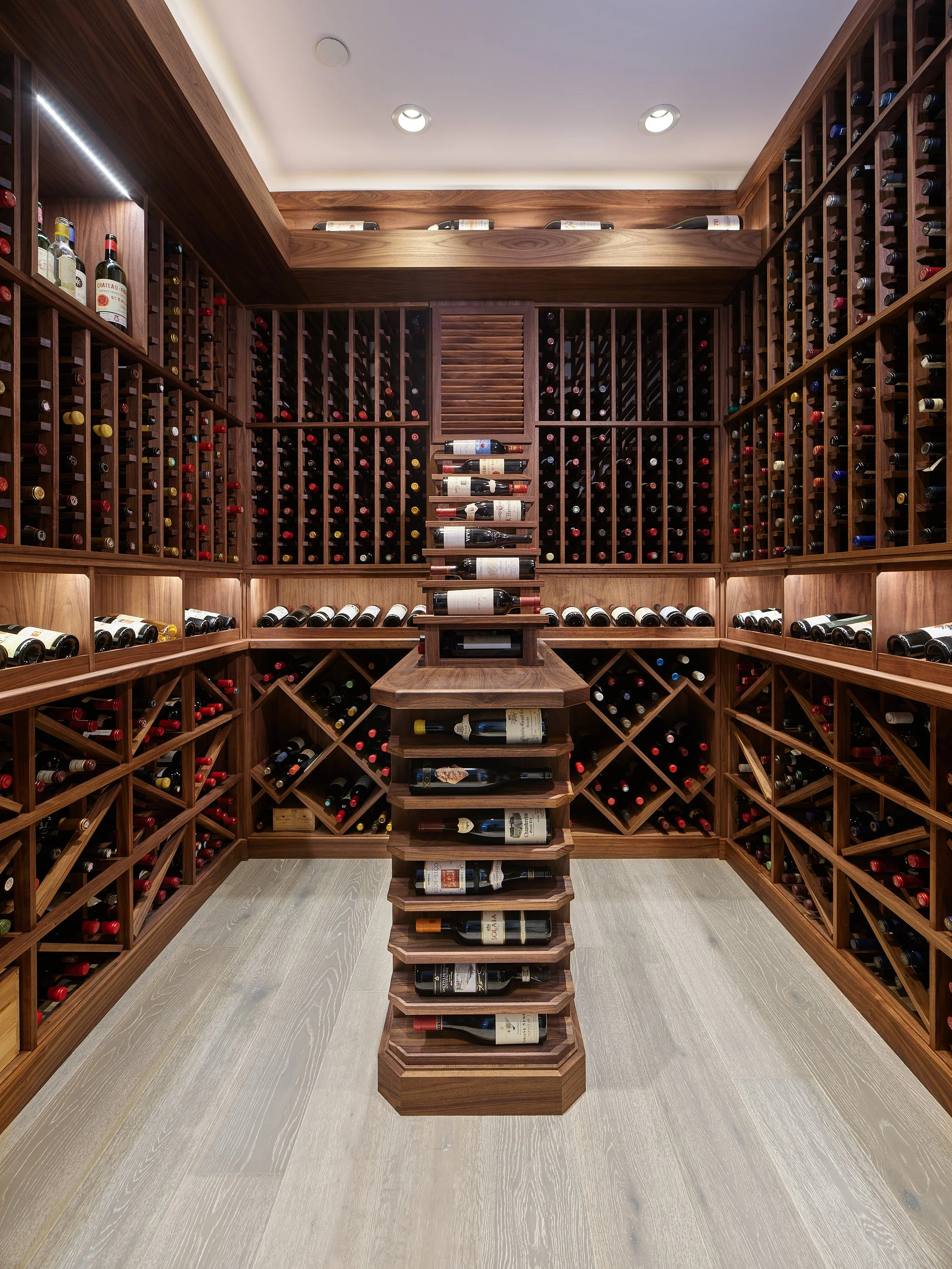 Walnut wine cellar with floor-to-ceiling bottle storage
